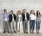 Group of elegant young businesspeople standing