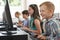 Group Of Elementary School Children In Computer Class