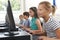 Group Of Elementary School Children In Computer Class