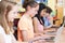 Group Of Elementary School Children In Computer Class