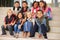 A group of elementary school kids sitting on school steps