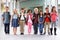 Group of elementary school kids standing in school corridor