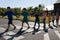 Group of elementary school pupils crossing a road