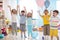 Group of emotional friends with their hands raised. Kids have fun pastime in daycare