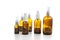 Group of empty glass spray bottles over white background