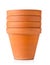 Group of empty, stacked, used terracotta planting pots over whit