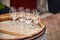 Group of empty transparent wineglasses standing on an old wooden barrel. Wine tasting