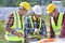 Group of engineers meeting on building roof