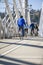 Group of enthusiastic cyclists rides on bikes across the Tilikum Crossing Bridge enjoying an informative sightseeing trip