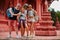 Group of european tourists taking group selfie at buddhist temple in thailand