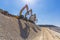 Group of excavators on gravel hill