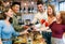 Group of excited happy young friends sharing a toast together