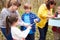 Group Exploring Woods At Outdoor Activity Centre