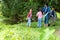 Group family asian children collecting garbage and plastic on the river to dumped