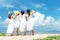 Group family asian woman wearing fashion white dress summer standing the sandy sea beach, outdoors sunshine background.
