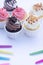 Group of fancy cup cakes on wooden table, birthday celebration concept
