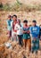 Group of farmers standing around an agricultural field