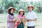 Group of farmers wearing a hat holding the crop and tablets