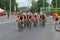 Group of female athletes on a bicycle section on a city street during of the 2019 Dnipro ETU Sprint Triathlon European Cup