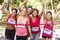 Group Of Female Athletes Completing Charity Marathon Race