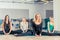 Group female employment with the trainer on a stretching in a sp