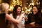 Group Of Female Friends Enjoying Evening Drinks In Bar