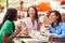 Group Of Female Friends Enjoying Lunch In Outdoor Restaurant