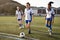 Group Of Female High School Students Playing In Soccer Team