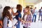 Group Of Female High School Students Talking By Lockers