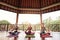 Group of female meditating in lotus pose in yoga class