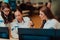 Group of female security operators working in a data system control room Technical Operators Working at workstation with