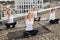 Group of females enhancing health via outside yoga workout