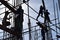 A group of Filipino Construction steel workers assembling steel bars on high-rise building with no proper protective suits and saf