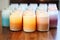 a group of finished frosted glass jar candles