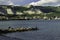 Group of fishermans fishing on stone breakwater.