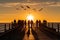 A group of fishermen standing on a pier at sunset