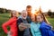 A group of fit and active people resting after doing exercise in nature, taking selfie.