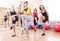 Group of Five Caucasian Female Athletes Having Stretching Exercises in Gym Together