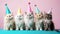 Group of five kittens wearing birthday party hats