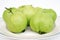 Group of flesh green common guava Psidium guajava, closeup