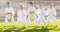 Group of focused schoolchildren practicing karate at park