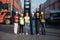 Group of foreman man & woman worker working checking at Container cargo harbor to loading containers. Dock male and female staff