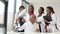 A group of four African American students discuss an X-ray with the doctor