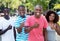 Group of four african american woman and man showing thumb