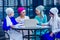 Group of four caucasian Muslim office lady discussing with a businesswoman partner job interview shawl and turban on