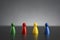 Group of four figurines in different colors in a row