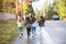 Group of four kids running to school