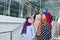 Group of four muslim girls walking at stairs of shopping mall