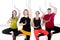 Group of four positive people doing Yoga practice in class