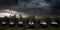 A group of four vehicles parked next to each other in a field. AI generative image